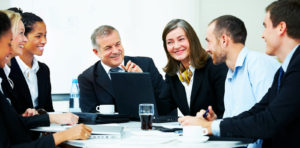 Business group meeting portrait - Five business people working together. A diverse work group.